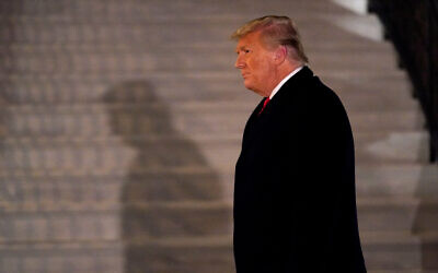 US President Donald Trump arrives on the South Lawn of the White House after a trip to Texas, Washington, Jan. 12, 2021. (AP Photo/Gerald Herbert)