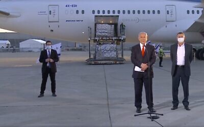 Health Minister Yuli Edelstein (R) and Prime Minister Benjamin Netanyahu at Ben Gurion Airport as a fresh batch of Pfizer vaccines arrives on January 10, 2021. (Screenshot: Facebook)