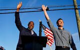 Then-Georgia Democratic candidates for US Senate Raphael Warnock, left, and Jon Ossoff, right, gesture toward a crowd during a campaign rally in Marietta, Georgia, November 15, 2020. (AP Photo/Brynn Anderson, File)