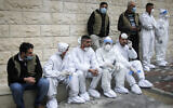 Palestinians sit as PA Prime Minister Mohammed Shtayyeh opens a hospital for COVID-19 patients in the West Bank city of Nablus, on January 16, 2021. (Nasser Ishtayeh/ Flash90)