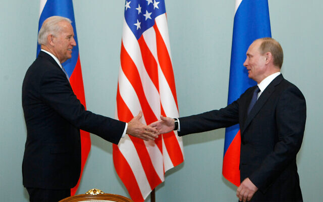 Then vice president of the United States Joe Biden, left, shakes hands with Russian Prime Minister Vladimir Putin in Moscow, Russia, March 10, 2011. (AP Photo/Alexander Zemlianichenko, File) Then vice president of the United States Joe Biden, left, shakes hands with Russian Prime Minister Vladimir Putin in Moscow, Russia, March 10, 2011. (AP Photo/Alexander Zemlianichenko, File)