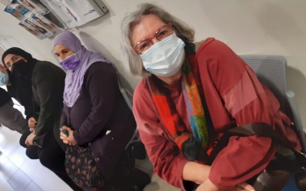 Naama Gatt, a 75-year-old kibbutznik, waiting for her vaccine in the Arab Israeli town of Baqa al-Gharbiyye, on January 3, 2020 (Nathan Jeffay/Times of Israel) Naama Gatt, a 75-year-old kibbutznik, waiting for her vaccine in the Arab Israeli town of Baqa al-Gharbiyye, on January 3, 2020 (Nathan Jeffay/Times of Israel)