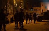 Illustrative: Israeli troops carry out searches in the central West Bank village of Deir Nidham, on January 3, 2021. (Israel Defense Forces)