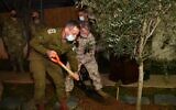 IDF Chief of Staff Aviv Kohavi, left, and the head of the US Central Command Gen. Kenneth McKenzie plant a tree in honor of the Jewish holiday of Tu Bishvat, on January 28, 2021. (Israel Defense Forces)
