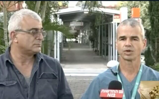 Screen capture from video of Ziv Yaffe, left, who was reinfected with the coronavirus, and Shai Efrati of the Assaf Harofeh Medical Center. (Channel 12 news) Screen capture from video of Ziv Yaffe, left, who was reinfected with the coronavirus, and Shai Efrati of the Assaf Harofeh Medical Center. (Channel 12 news)