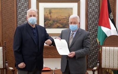 Palestinian Authority President Mahmoud Abbas alongside Central Elections Commissioner Hana Naser on Friday, January 15, 2021, announcing an election decree (WAFA)