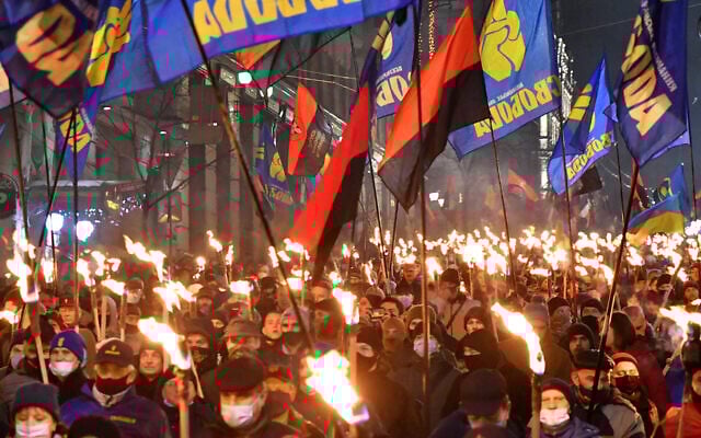 Participants of an annual event in honor of Stepan Bandera march through Kyiv, Ukraine on Jan. 1, 2021. (Genya Savilou/AFP) Participants of an annual event in honor of Stepan Bandera march through Kyiv, Ukraine on Jan. 1, 2021. (Genya Savilou/AFP)