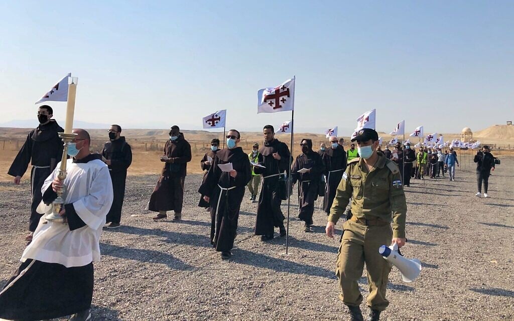 Priests walk from the St John the Baptist Chapel to the banks of the Jordan River, January 10, 2021. (Amanda Borschel-Dan/Times of Israel)