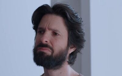 Erez Drigues and his large locks of hair appearing in "Rehearsals." (Screen capture: Kan)