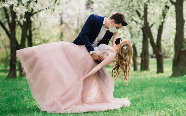 Illustrative: A couple in medical masks on their wedding day (Ivan Zelenin; iStock by Getty Images) Illustrative: A couple in medical masks on their wedding day (Ivan Zelenin; iStock by Getty Images)