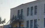 Screen grab from a video apparently showing students entering a yeshiva in Beitar Illit despite the government lockdown (Channel 12 news)