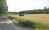 A sign at the entrance to the village of Malinowo, Poland. (Google Maps)