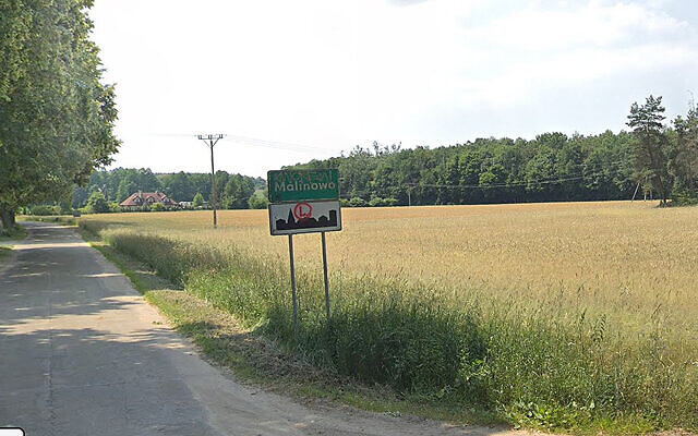 A sign at the entrance to the village of Malinowo, Poland. (Google Maps)