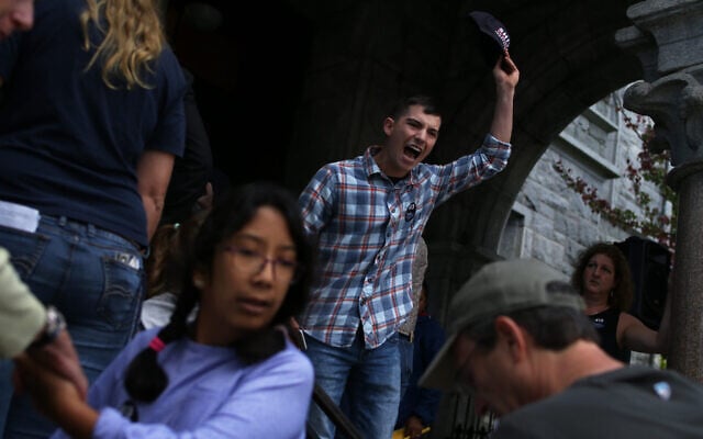 Louis Shenker protests outside a town hall held by US Senator Elizabeth Warren in 2018. (Michael Swensen/The Boston Globe via Getty Images/JTA) Louis Shenker protests outside a town hall held by US Senator Elizabeth Warren in 2018. (Michael Swensen/The Boston Globe via Getty Images/JTA)
