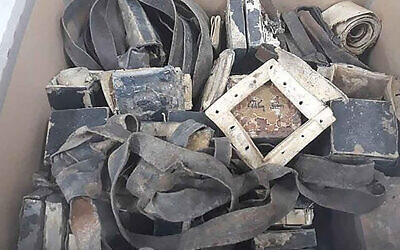 10 sets of tefillin that the Shem Olam Holocaust museum said were found in Warsaw, Poland. (Courtesy of Shem Olam Faith & the Holocaust Institute for Education, Documentation & Research via JTA)