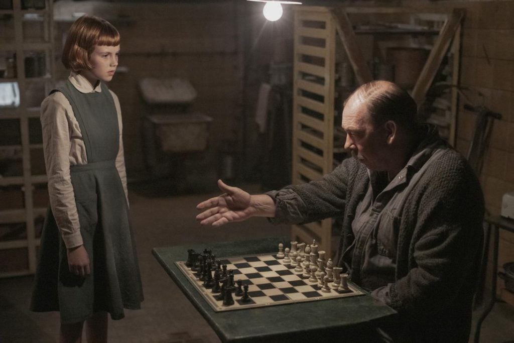 The character Beth Harmon with her mentor, Mr. Shaibel, at the orphanage in 'The Queen's Gambit' (Courtesy). The character Beth Harmon with her mentor, Mr. Shaibel, at the orphanage in 'The Queen's Gambit' (Courtesy).