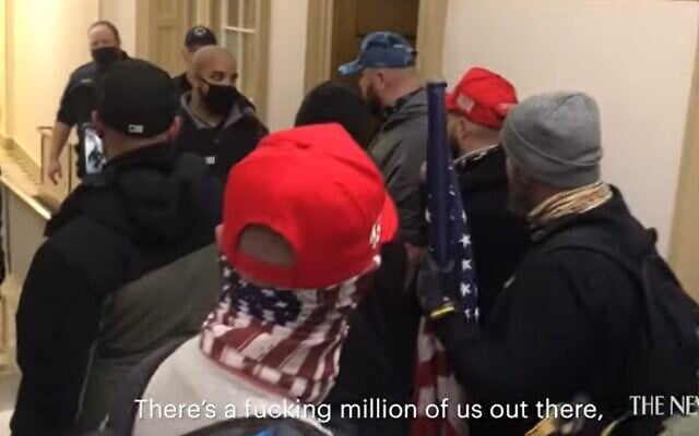 Pro-Trump rioters threaten police after breaking into the US Capitol on January 6, 2021 (Screencapture/YouTube)