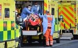 London Ambulance staff stretcher a patient from the ambulance into The Royal London Hospital in east London, on January 2, 2021. (DANIEL LEAL-OLIVAS / AFP)