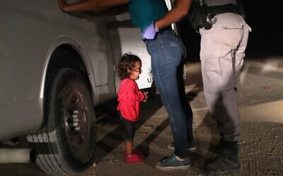 In this file photo taken on June 11, 2018 a two-year-old Honduran asylum seeker cries as her mother is searched and detained near the US-Mexico border in McAllen, Texas (JOHN MOORE / GETTY IMAGES NORTH AMERICA / AFP)