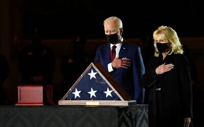 US President Joe Biden and First Lady Jill Biden pay their respects to late US Capitol Police officer Brian Sicknick, as he lies in honor in the Capitol Rotunda in Washington, DC February 2, 2021. (Erin Cchaff / POOL / AFP)