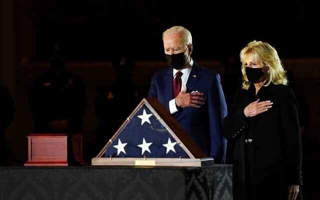 US President Joe Biden and First Lady Jill Biden pay their respects to late US Capitol Police officer Brian Sicknick, as he lies in honor in the Capitol Rotunda in Washington, DC February 2, 2021. (Erin Cchaff / POOL / AFP) US President Joe Biden and First Lady Jill Biden pay their respects to late US Capitol Police officer Brian Sicknick, as he lies in honor in the Capitol Rotunda in Washington, DC February 2, 2021. (Erin Cchaff / POOL / AFP)
