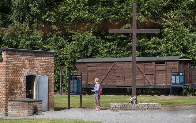 In this file photo taken on July 21, 2020 a woman is seen next to a gas chamber at the museum of the former Nazi Death Camp Stutthof, in Sztutowo, July 21, 2020. (Wojtek RADWANSKI / AFP) In this file photo taken on July 21, 2020 a woman is seen next to a gas chamber at the museum of the former Nazi Death Camp Stutthof, in Sztutowo, July 21, 2020. (Wojtek RADWANSKI / AFP)