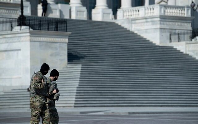Members of the National Guard walk on Capitol Hill before the beginning of the first day of former US President Donald Trump's trial before the Senate February 9, 2021, in Washington, DC. (Brendan Smialowski / AFP) Members of the National Guard walk on Capitol Hill before the beginning of the first day of former US President Donald Trump's trial before the Senate February 9, 2021, in Washington, DC. (Brendan Smialowski / AFP)
