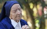 Sister Andre, Lucile Randon in the registry of birth, the eldest French and European citizen, prays in a wheelchair, on the eve of her 117th birthday - born on February 11, 1904 ( NICOLAS TUCAT / AFP)