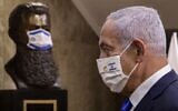 Prime Minister Benjamin Netanyahu at the Prime Minister's Office in Jerusalem on February 14, 2021, in front of a mask-clad bust of Theodor Herzl, the founder of modern Zionism. (Marc Israel Sellem/Pool/AFP)