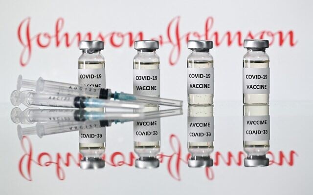 Vials with COVID-19 vaccine stickers attached and syringes with the logo of US pharmaceutical company Johnson & Johnson, November 17, 2020. (Justin Tallis/AFP) Vials with COVID-19 vaccine stickers attached and syringes with the logo of US pharmaceutical company Johnson & Johnson, November 17, 2020. (Justin Tallis/AFP)