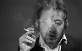 A file photo taken on March 11, 1984 shows French singer-songwriter Serge Gainsbourg smoking during the 7 sur 7 tv show at the Studio Cognacq-Jay in Paris. (PHILIPPE WOJAZER / AFP)