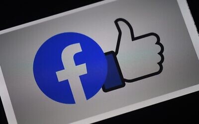 A Facebook App logo is displayed on a smartphone in Arlington, Virginia, March 24, 2020. (Olivier Douliery/AFP)