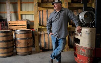 Former congressman Denver Riggleman in his barrel barn, where he ages spirits from the Virginia distillery that he co-owns with his wife, Nov. 20, 2020. (John McDonnell/The Washington Post via Getty Images /JTA)
