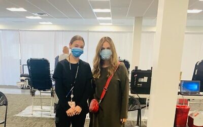 Zeldy Oppen, right, with a nurse at a Covid Plasma Initiative plasma drive. (Courtesy)