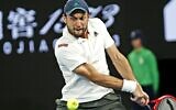 Aslan Karatsev returns a shot against Novak Djokovic at the Australian Open in Melbourne, Australia, Feb. 18, 2021 (Peter Haskin / Australian Jewish News)