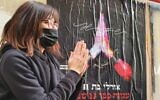 Orly, whose personal details as an aguna, a chained woman, are listed on one of the posters plastered in south Tel Aviv as part of Yom HaAguna, February 24, 2021 (Courtesy DODO)