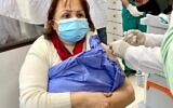 Palestinian Authority Health Minister Mai Al-Kaila receives a shot of the Moderna coronavirus vaccine on Wednesday, February 3, 2021 (WAFA)
