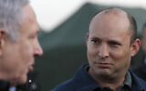 In this November 24, 2019, photo, Defense Minister Naftali Bennett (right) and Prime Minister Benjamin Netanyahu visit an army base in the Golan Heights, on the Israeli-Syrian border. (Atef Safadi/Pool via AP)