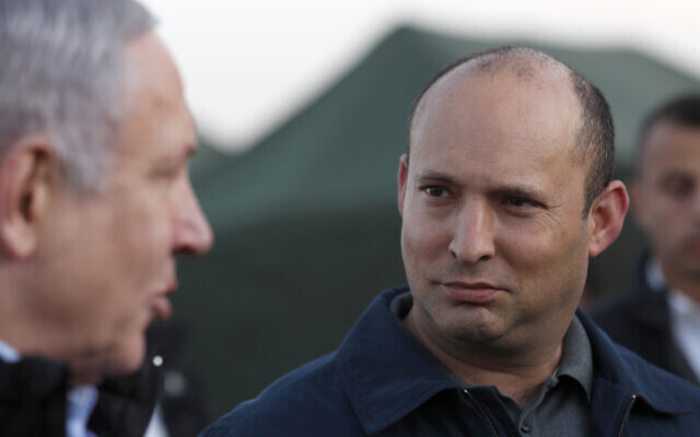 In this Sunday, November 24, 2019 photo, then-defense minister Naftali Bennett and Prime Minister Benjamin Netanyahu visit an Israeli military base in the Golan Heights, on the Israeli-Syrian border. (Atef Safadi/Pool via AP, File) In this Sunday, November 24, 2019 photo, then-defense minister Naftali Bennett and Prime Minister Benjamin Netanyahu visit an Israeli military base in the Golan Heights, on the Israeli-Syrian border. (Atef Safadi/Pool via AP, File)