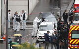 Police and forensic investigators at the scene of an attack that wounded two people near the former offices of the satirical newspaper Charlie Hebdo, in Paris, France, September 25, 2020. Thibault Camus/AP)