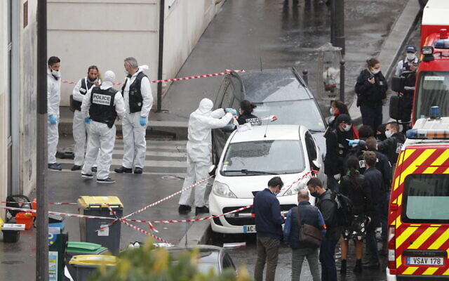 Police and forensic investigators at the scene of an attack that wounded two people near the former offices of the satirical newspaper Charlie Hebdo, in Paris, France, September 25, 2020. Thibault Camus/AP) Police and forensic investigators at the scene of an attack that wounded two people near the former offices of the satirical newspaper Charlie Hebdo, in Paris, France, September 25, 2020. Thibault Camus/AP)