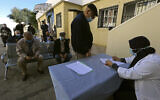 In this February 3, 2021, photo, a man registers to get the COVID-19 vaccine, in Algiers, Algeria. (AP/Fateh Guidoum)