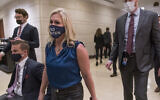 Rep. Marjorie Taylor Greene, R-Ga., walks with fellow House Republicans on Capitol Hill in Washington, February 3, 2021, following a meeting called by House Minority Leader Kevin McCarthy.  (AP Photo/J. Scott Applewhite)