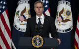 US Secretary of State Antony Blinken introduces President Joe Biden for remarks to State Department staff, February 4, 2021, in Washington. (AP Photo/Evan Vucci)