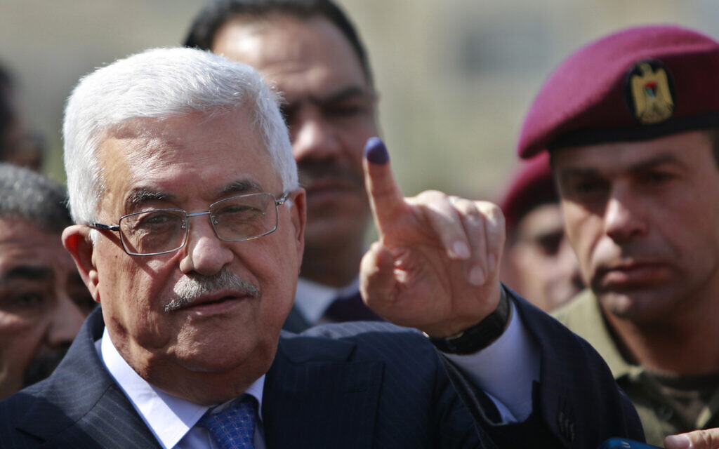 In this October 20, 2012, photo, Palestinian Authority President Mahmoud Abbas shows his ink-stained finger after casting his vote during local elections at a polling station in the West Bank city of Ramallah. (AP/Majdi Mohammed) In this October 20, 2012, photo, Palestinian Authority President Mahmoud Abbas shows his ink-stained finger after casting his vote during local elections at a polling station in the West Bank city of Ramallah. (AP/Majdi Mohammed)