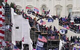 Rioters loyal to US President Donald Trump storm the US Capitol in Washington, January 6, 2020. (AP Photo/John Minchillo, File)