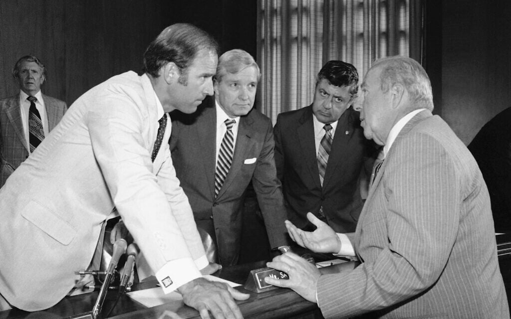 In this July 13, 1982, file photo Secretary of State designate George Shultz, right, speaks with members of the Senate Foreign Relations Committee prior to the start of the afternoon session of the panel on Capitol Hill in Washington. From left are, Sen. Joseph Biden, D-Del.; Sen. Charles Percy, R-Ill., chairman of the panel and Sen. Edward Zorinsky, D-Neb. (AP Photo/Ira Schwarz, File)