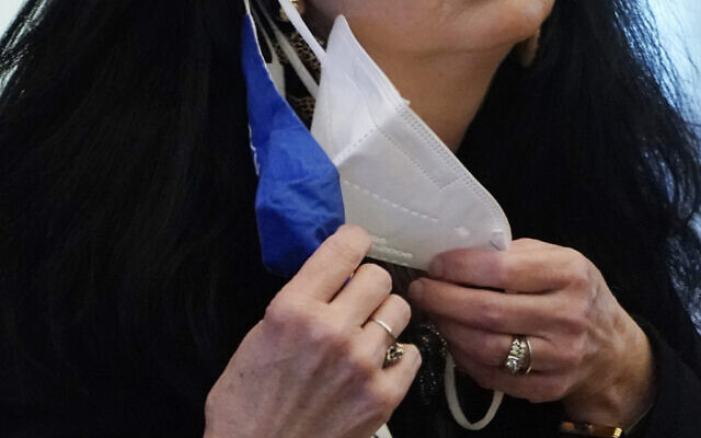 A state legislator adjusts her face masks while asking a question at the Capitol in Jackson, Mississippi, February 4, 2021. (AP Photo/Rogelio V. Solis) A state legislator adjusts her face masks while asking a question at the Capitol in Jackson, Mississippi, February 4, 2021. (AP Photo/Rogelio V. Solis)