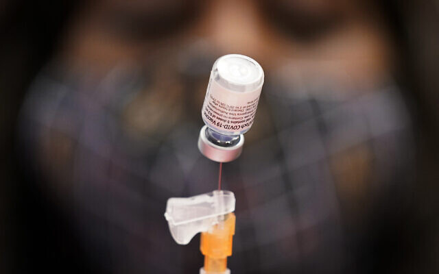 Illustrative: A medical assistant prepares a dose of the Pfizer-BioNTech COVID-19 vaccine at a vaccination center at the University of Nevada, Las Vegas, January 22, 2021. (AP Photo/John Locher, File) Illustrative: A medical assistant prepares a dose of the Pfizer-BioNTech COVID-19 vaccine at a vaccination center at the University of Nevada, Las Vegas, January 22, 2021. (AP Photo/John Locher, File)
