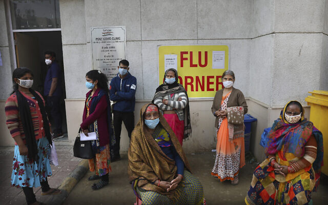 People wait outside a health center to get tested for coronavirus in New Delhi, India, February 11, 2021. (AP Photo/Manish Swarup) People wait outside a health center to get tested for coronavirus in New Delhi, India, February 11, 2021. (AP Photo/Manish Swarup)
